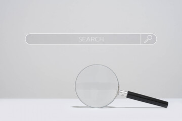 Magnifying glass below a search bar on a plain background, representing search engine and exploration concepts.