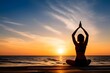 © Dhanuja - yoga on the beach at sunset with copy space