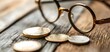 © Paisan - Exploring Financial Investment: The Intriguing World of Coins and Glasses on a Rustic Surface