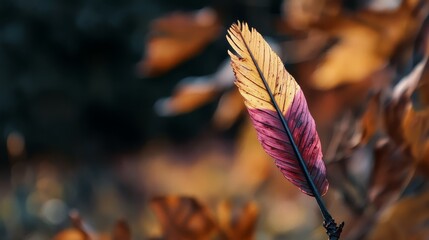 Wall Mural -  A tight shot of a red-and-yellow leaf on a twig amidst a sea of brown and yellow leaves