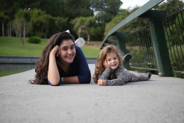 two girls sitting on steps