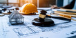 © Maksym - A gavel resting on an architectural plan, with a hard hat and a miniature house model beside it, symbolizing the intersection of law, labor, and construction