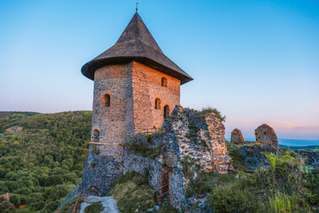 Ruins of a medieval castle Somoska or Somoskoi var on borders of southern Slovakia and Hungary at sunrise time.