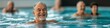 © Andrii Zastrozhnov - A man is smiling while swimming in a pool. The other people in the pool are also smiling. Scene is happy and relaxed