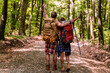 © ivanko80 - Couple hiking with backpacks in the forest