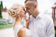 © anatoliycherkas - Romantic Bride And Groom Sharing A Tender Moment On Their Wedding Day Outdoors