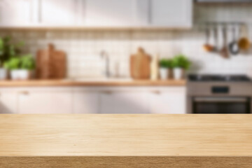 Wall Mural - Kitchen wood table top for product display with blurred modern interior. Wooden tabletop over defocused kitchen background. kitchen furniture and desk space. product promotion in the kitchen