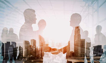 Wall Mural - double exposure image of many business people conference group meeting on city office building in ba