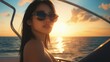© saichon - Elegant woman in a bikini and sun hat relaxing on a yacht under the bright sun, enjoying a luxurious day at sea.