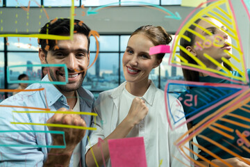 Portrait of happy business team celebrate their successful project at glass wall. Group of professional confidence businesspeople smiling while standing at financial statistic chart. Closeup. Tracery.