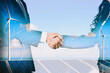 © Summit Art Creations - Double exposure graphic of business people handshake over wind turbine farm and green renewable energy worker interface. Concept of sustainability development by alternative energy. uds
