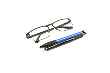 Business blue and black ballpoint pen with reading glasses isolated on white background.