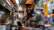 © Generative AI - Black man making payment with smartphone in food truck : Generative AI