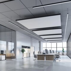 Canvas Print - Modern open plan office with large windows, wooden desks, and white ceiling.