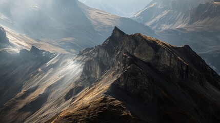 Wall Mural - A Rugged Mountain Peak Bathed in Sunlight