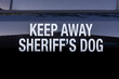 © F Armstrong Photo - Signs warning that a K-9 dog is in a Sherriff's vehicle