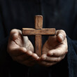 © Reality - Hands Holding a Wooden Cross Symbol