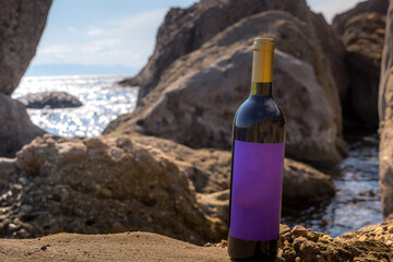 Wall Mural - Bottle of wine by the sea