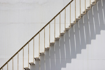 Wall Mural - A staircase with a white railing and white steps