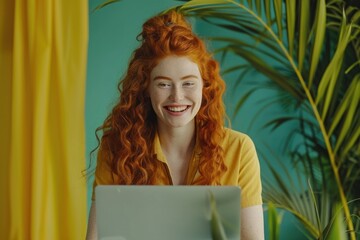 Wall Mural - A beautiful, cheerful, red-haired female student who is smiling and using a laptop to make a video call with her teacher. The concept of distance learning of modern internet technology.