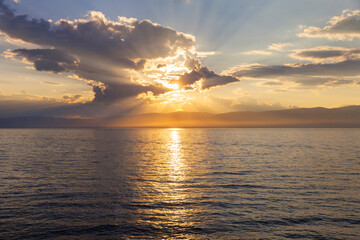 Wall Mural - colorful sky landscape with sunset over sea. siberian baikal lake in sundown light. sunset over smal