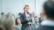 © NHA Studio - Female Politician at Town Hall Meeting - A woman engaging with attendees at a town hall meeting, delivering a speech.