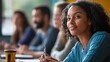 © keetazalay - An adult learning class in a community center, with participants attentively listening to the instructor and taking notes, showcasing the importance of continuing education, the concept of lifelong