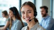 © Nikolaus - A smiling customer service representative with a headset, ready to assist, against the backdrop of a modern call center.