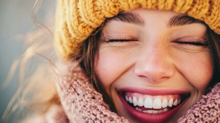 Wall Mural - A woman with a yellow hat and a pink scarf is smiling and has her mouth open