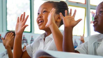 Children Engaged in Learning Activities in a Bright Classroom at School