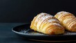 © KYR - Golden sfogliatella placed on a contemporary plate with a black background, offering an elegant and striking visual with space for ad content.