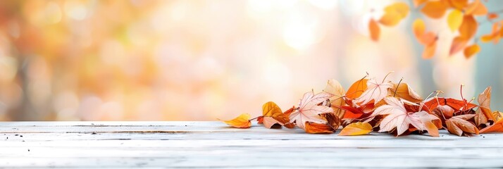 A serene autumn scene with colorful fallen leaves on a wooden surface. Warm and inviting fall foliage background perfect for seasonal compositions.