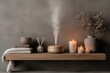 © Milos - A beautifully arranged wooden shelf with a diffuser, candles, and decorative items, creating a warm and cozy ambiance with a sense of tranquility and relaxation.
