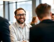 © imgstocker - Smiling Professional Man with Beard and Glasses in Office Meeting