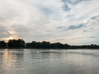 Sticker - A calm lake with a cloudy sky in the background