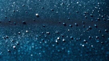 Wall Mural - water droplets on a deep blue surface: a close-up photograph showcasing a mesmerizing collection of 