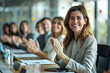 © Kowit - Leading a Cheery Office Celebration Businesswoman Motivating Team in Conference Room with Colleagues Clapping and Congratulating