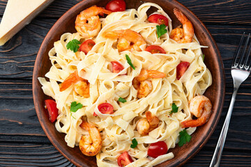 Canvas Print - Italian pasta with shrimps , parmesan and tomatoes