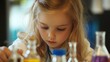 © Khritthithat - Young girl conducting a simple chemistry experiment, child, learning, habits
