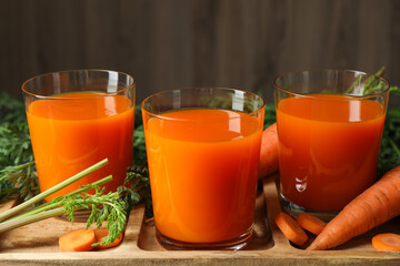 Poster - Healthy carrot juice in glasses and fresh vegetables on table