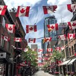 © Erik - Canadian Flags Flying Proudly on Buildings and Streets Decorated