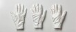 © Viktor - Two pairs of white gloves on separate white tables