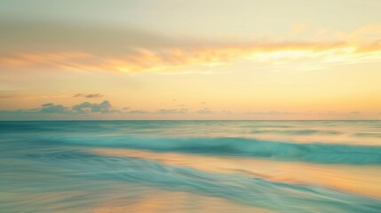 Canvas Print - Blurry beach backdrop with yellow and blue sky at sunrise