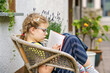 © Irina Schmidt - Little girl with eyeglasses reading book. Happy interested child learning.