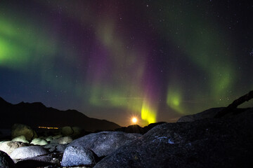 TROMSO, NORWAY - SEPTEMBER 18 2014: Northern lights seen on a cold autumn night in Tromsø, Norway during a tour.