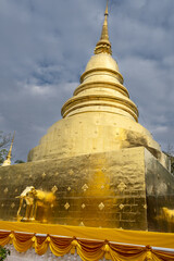 Wall Mural - Gold-covered Chedi PhraThatLuang in Wat Phra Singh Temple in Chiang Mai, Thailand