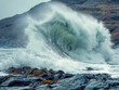 © MaxK - A large wave crashing into the shore. The water is white and the rocks are grey. Scene is powerful and dramatic