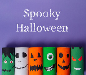 Wall Mural - A group of paper tubes with Halloween faces on them