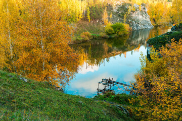 Wall Mural - A beautiful autumn day with a lake in the background