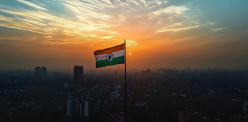 Indian Flag Waving in the Sunset Over City Skyline